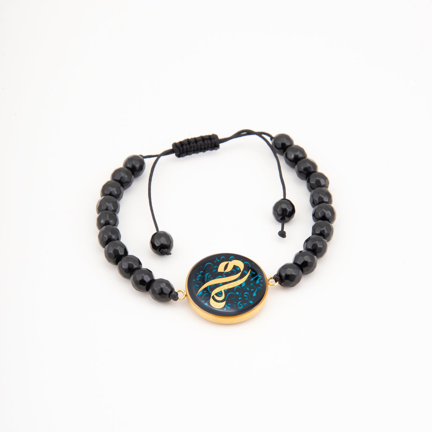 Bracelet, M like Mama, 24 carat gold leaf, onyx