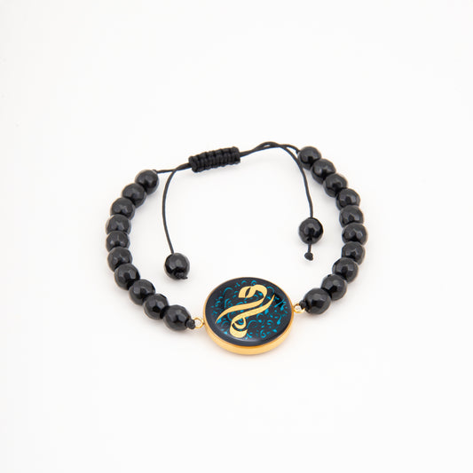 Bracelet, M like Mama, 24 carat gold leaf, onyx