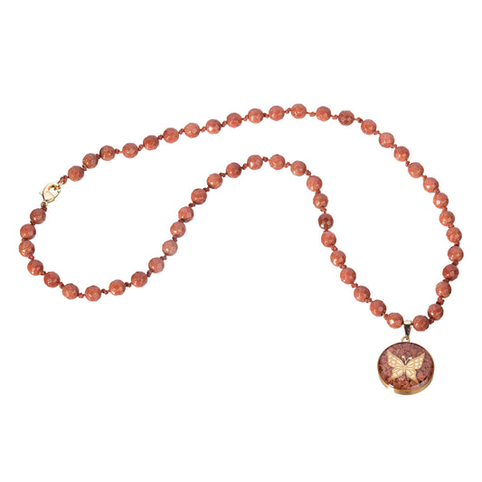 Goldstone necklace with butterfly pendant made of 24 carat gold leaf